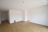 Wohn- Essbereich 1.1 - Neubauwohnung mit sonniger Terrasse und kleinem Garten im Neubaugebiet im Timp