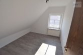 Schlafzimmer WHG DG - lukratives 3-Familienhaus in Südbrookmerland! nahe der zukünftigen Zentralklinik!