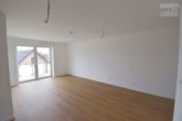Wohnbereich mit Balkon - Neubauwohnung mit Balkon in Aurich – Erstbezug